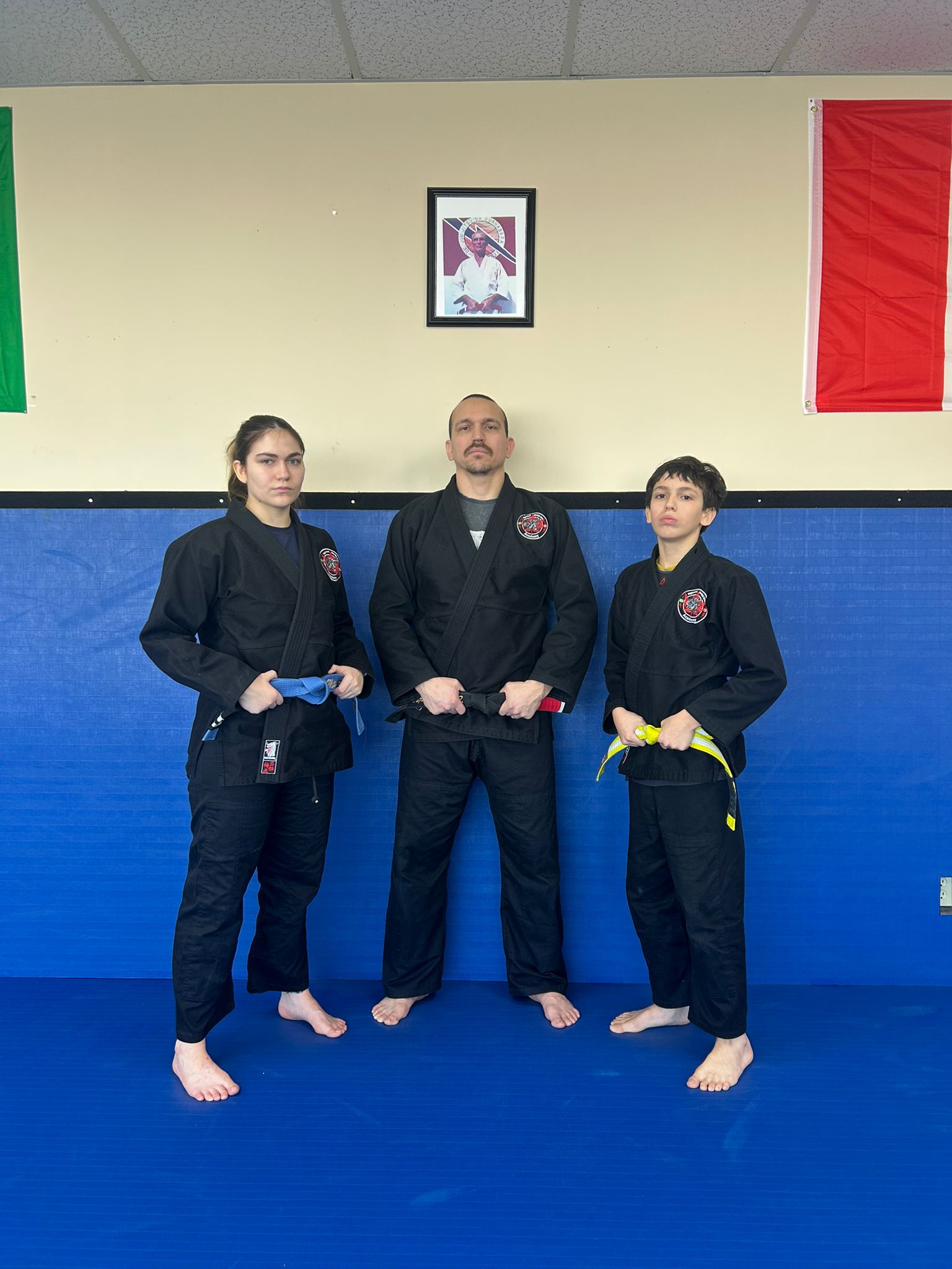 Professor Daniel Fonseca with family on the mats at Raymond Martial Arts Academy